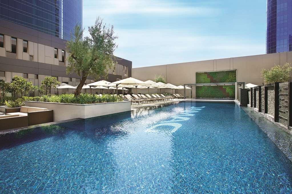 Damac Maison Cour Jardin Дубай Удобства фото The swimming pool at the hotel
